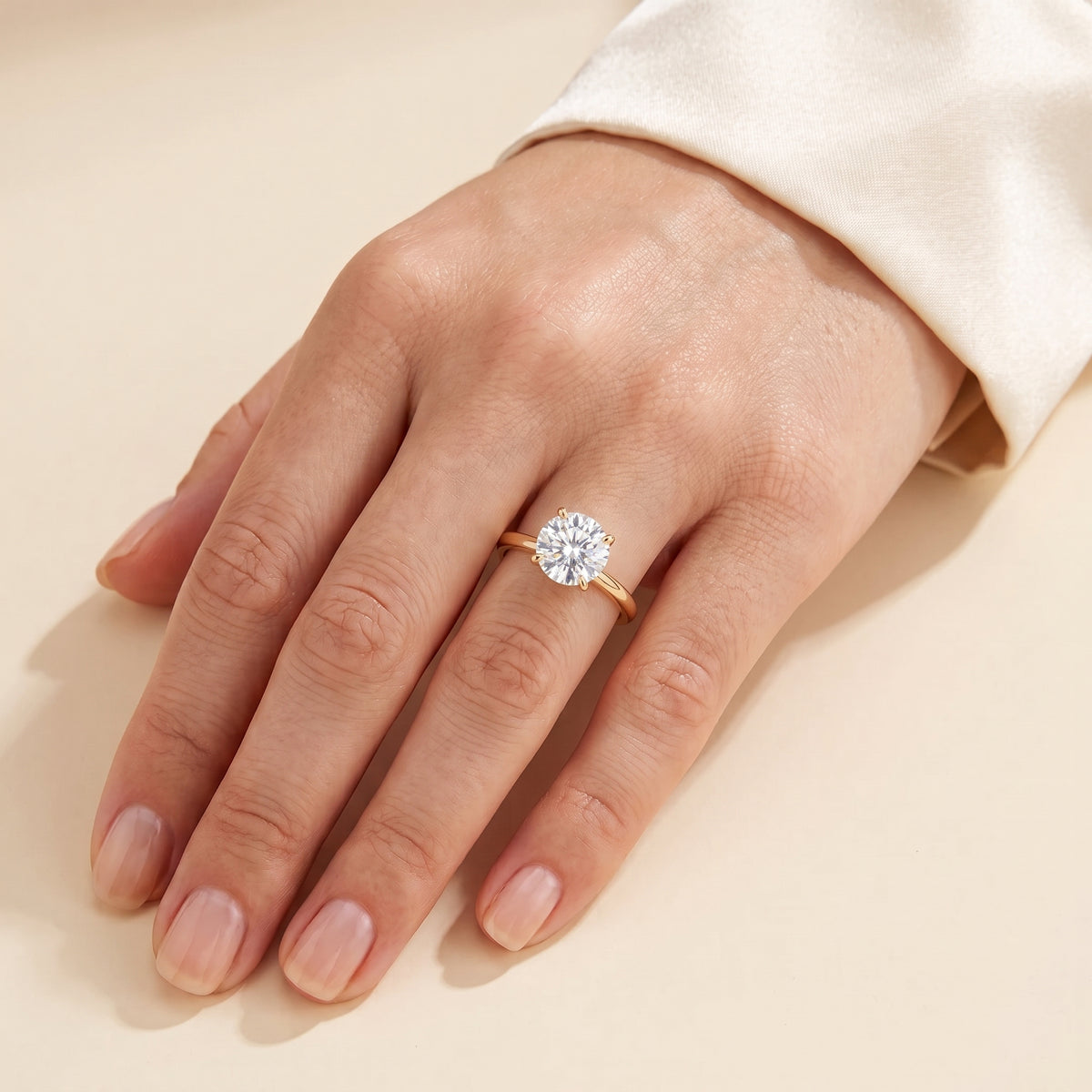 A model is wearing Nina Round Shape Diamond Cathedral Solitaire Ring