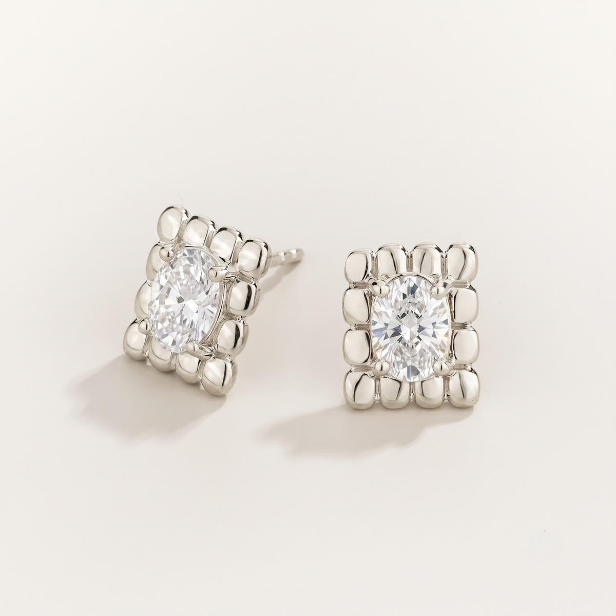 Fondi Oval Diamond Sculpted White Gold Stud Earrings – front view