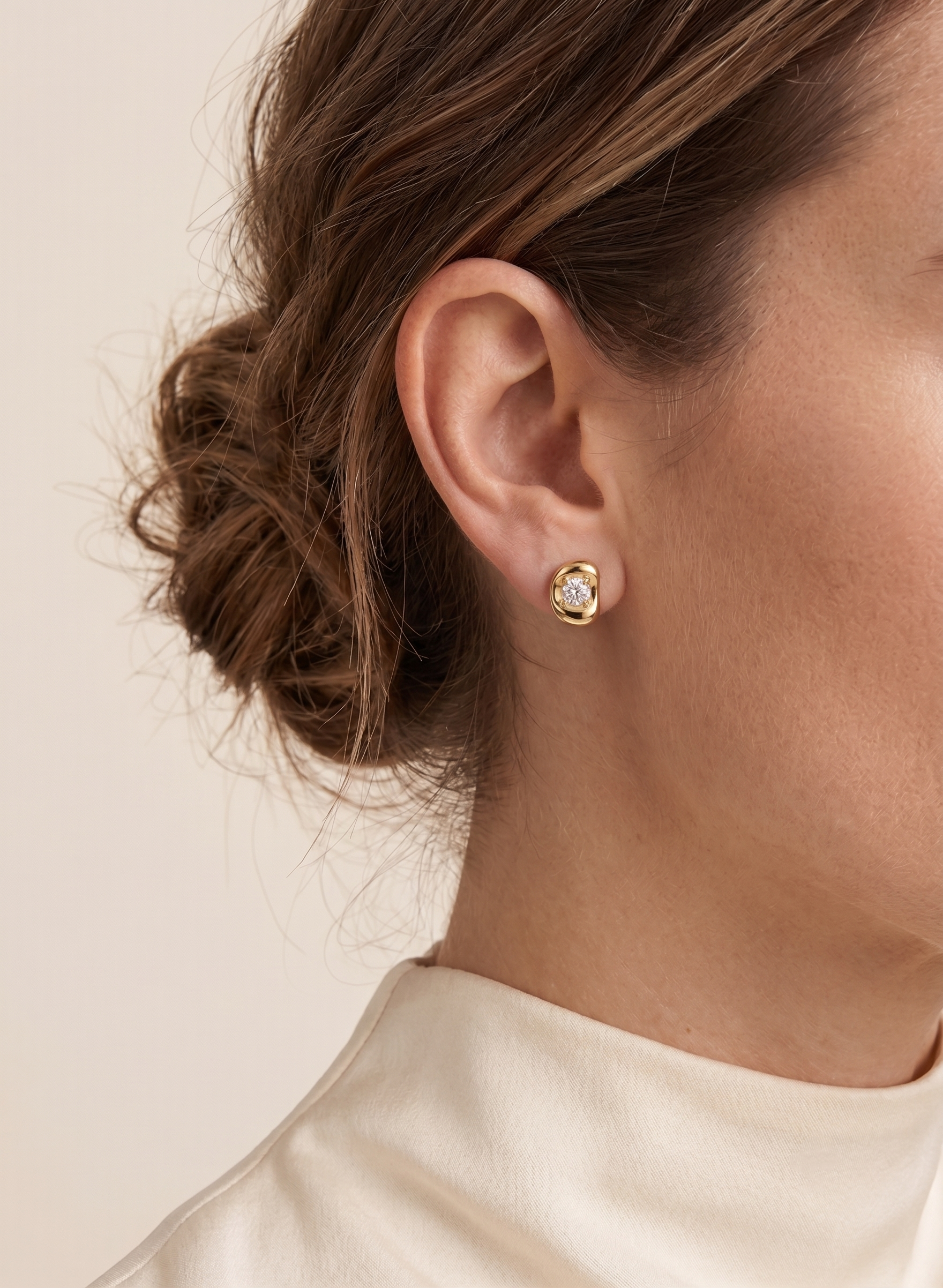 Fava Oval Diamond Stud Earrings worn on ear