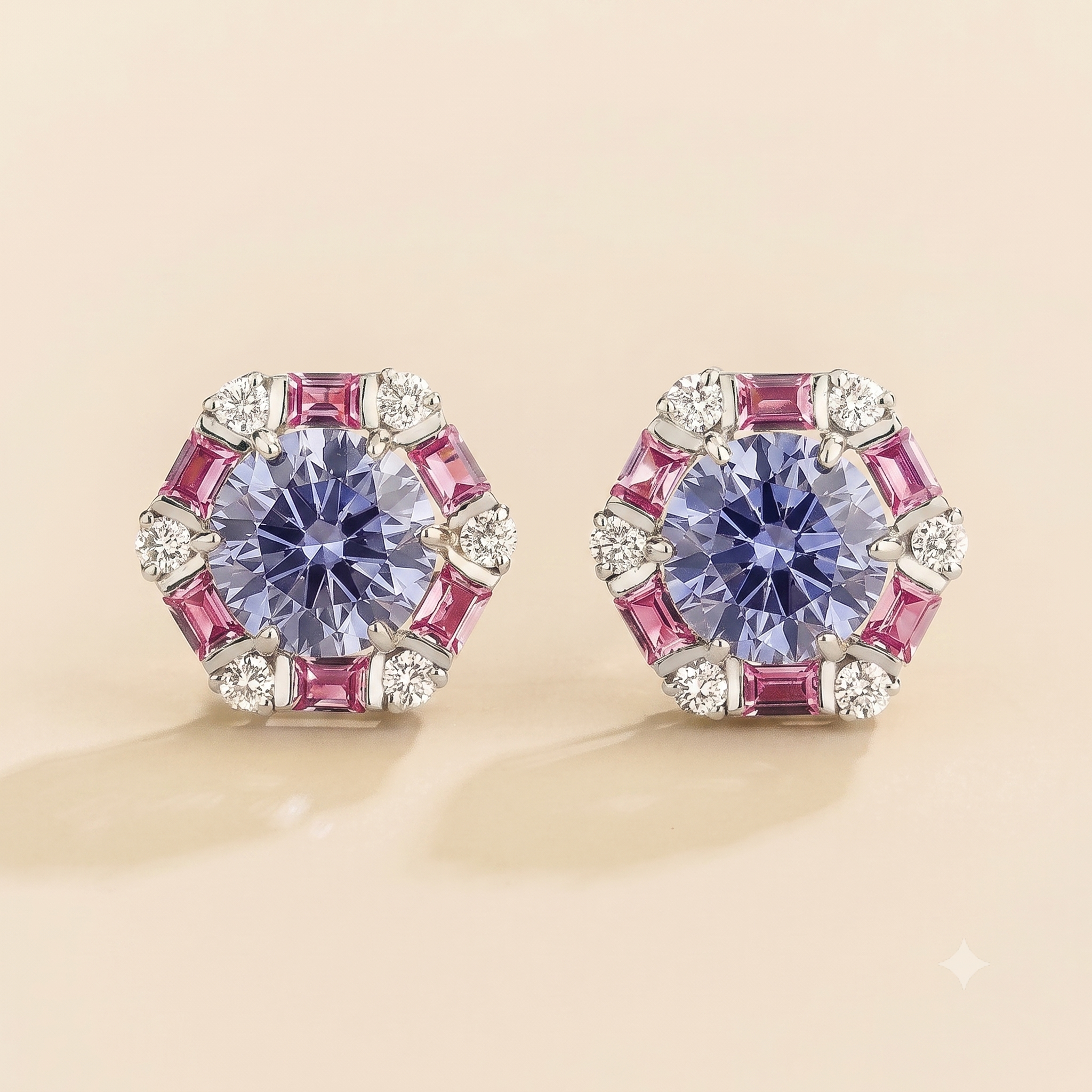 Hexagon halo lab-grown pastel blue sapphire, pink sapphire and diamond stud earrings, Melba design in white gold | Juvetti London