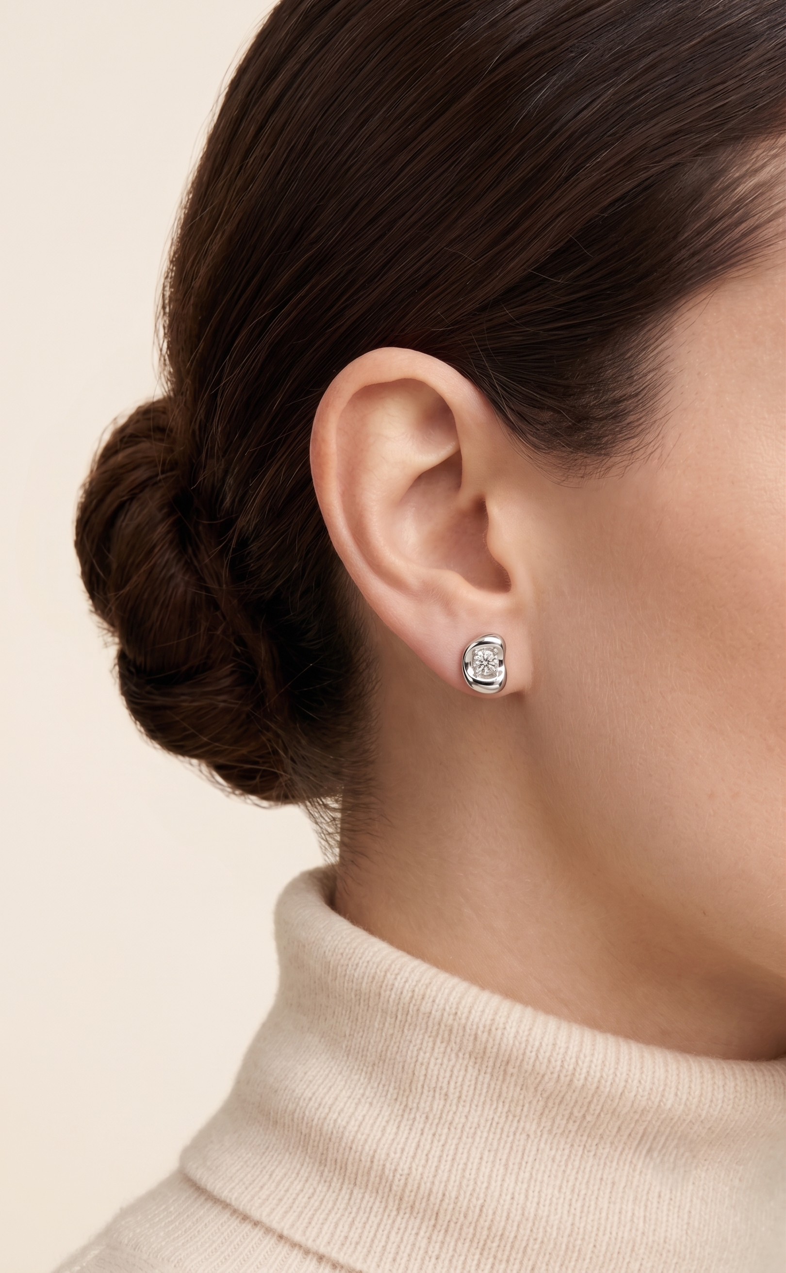 Fava Oval Diamond Stud Earrings worn on ear