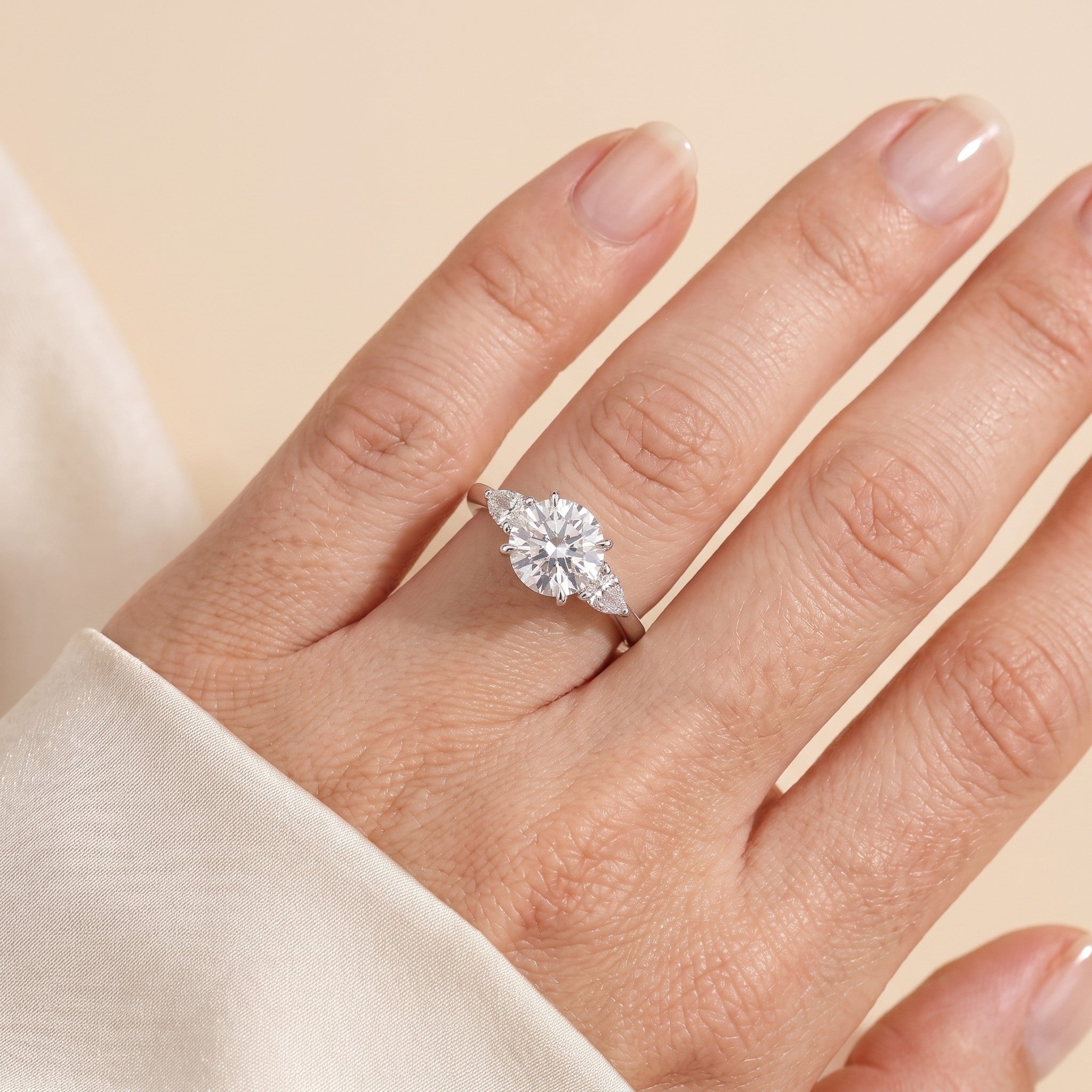 The model is wearing Rosey Diamond Round Cut & Pear Cut White Gold Ring