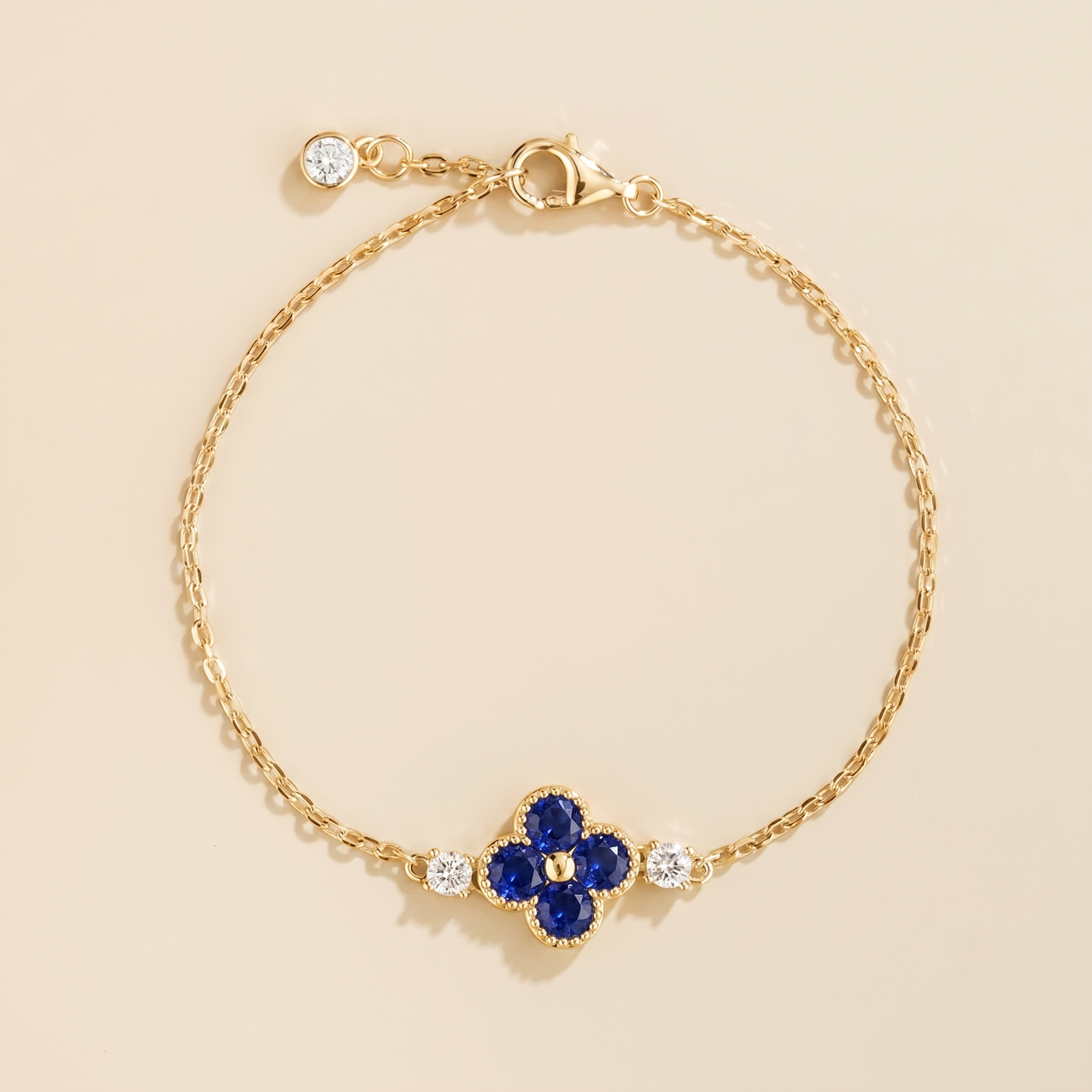Lab-grown Blue Sapphire and diamond four-leaf clover chain bracelet in gold | Juvetti London