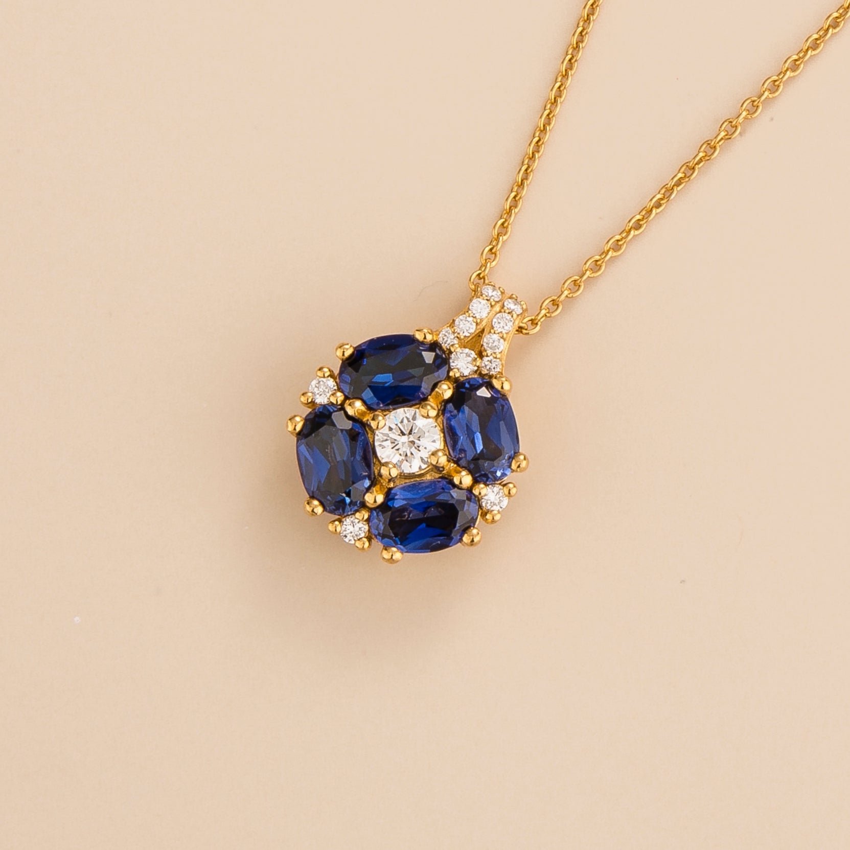 Pristi pendant necklace in 18K gold vermeil set with lab grown Diamonds and Blue sapphire gem stones. Perfect for yourself and as gift.