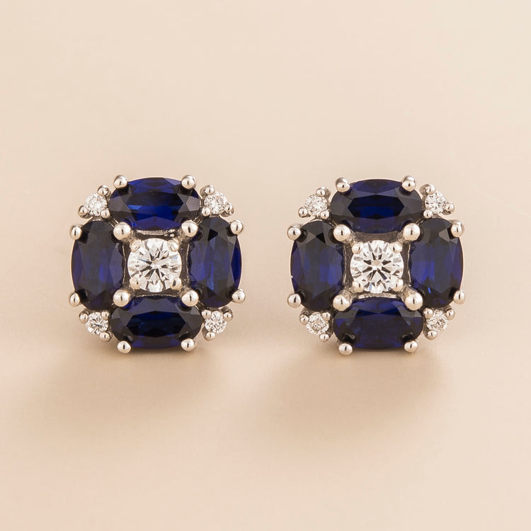 Pristi earrings in 18K white gold vermeil set with lab grown Diamond and oval Blue Sapphire gem stones.