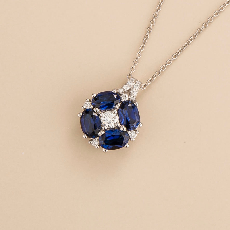Pristi pendant necklace in 18K white gold vermeil set with lab grown Diamond and oval Blue Sapphire gem stones.