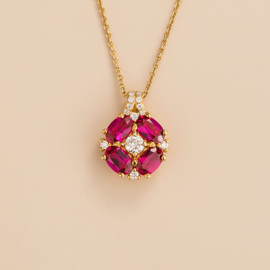 Pristi pendant necklace in 18K gold vermeil set with lab grown Diamond and oval cut Ruby gem stones.