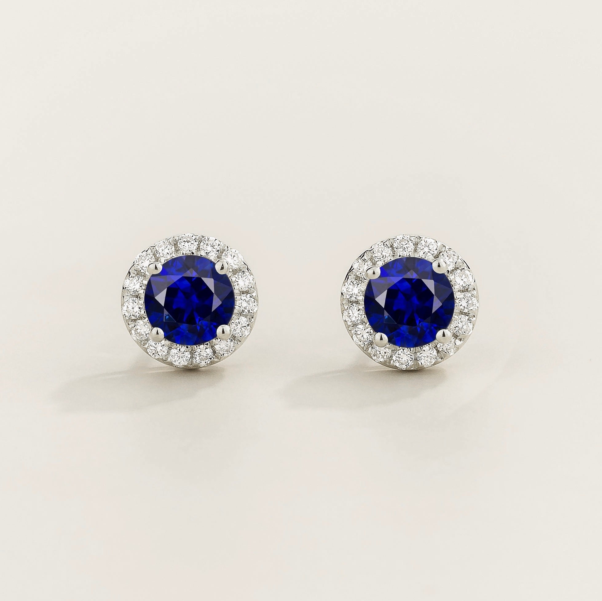 Mars Blue Sapphire Round & Diamond Halo Earrings In White Gold