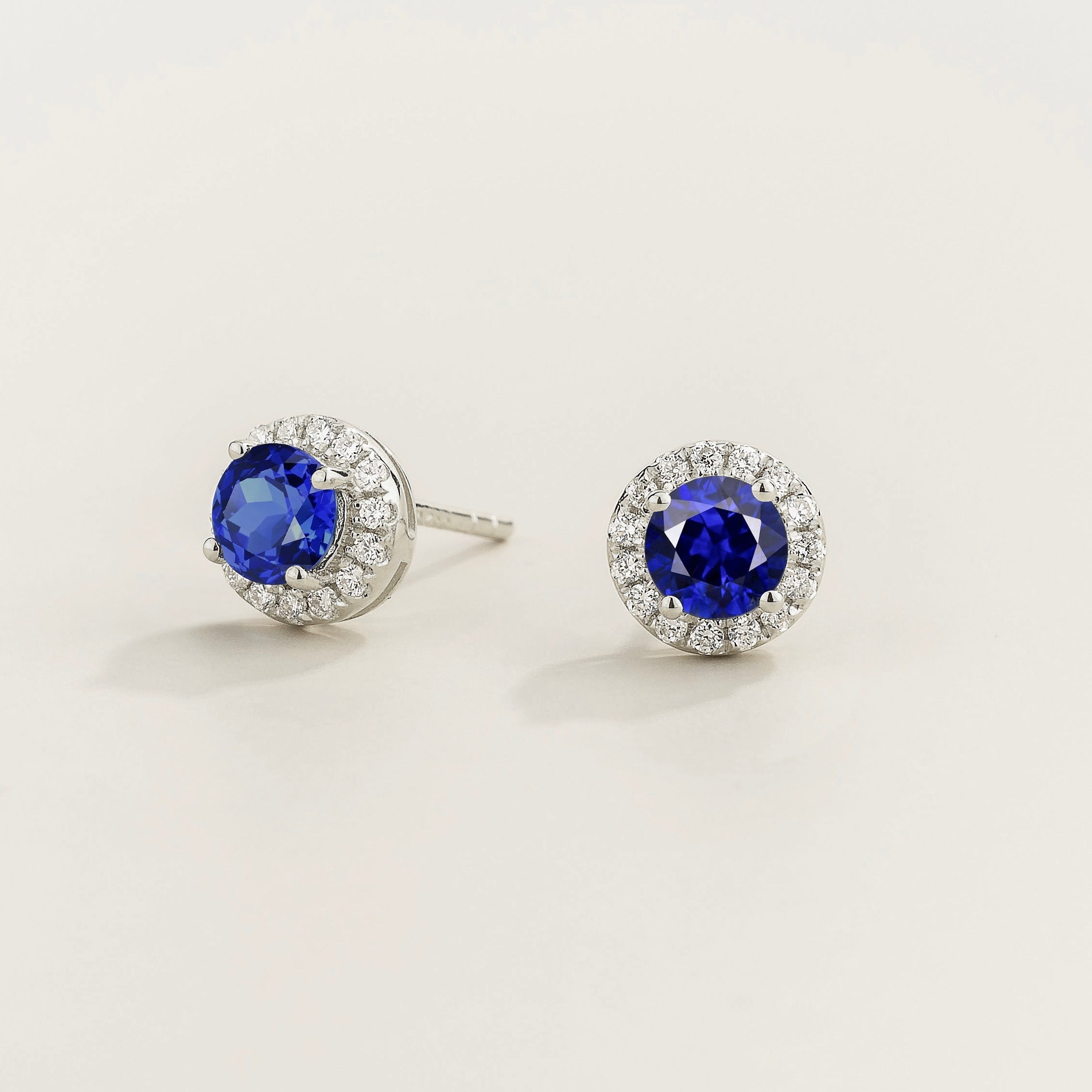 Mars Blue Sapphire Round & Diamond Halo Earrings In White Gold