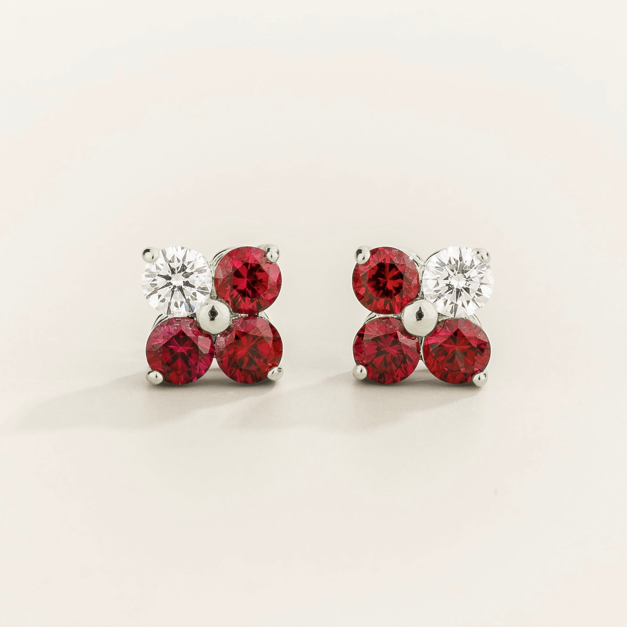Petale 4-gemstones stud earrings in white gold set with ~0.7 carats of ruby and ~0.2 Diamonds