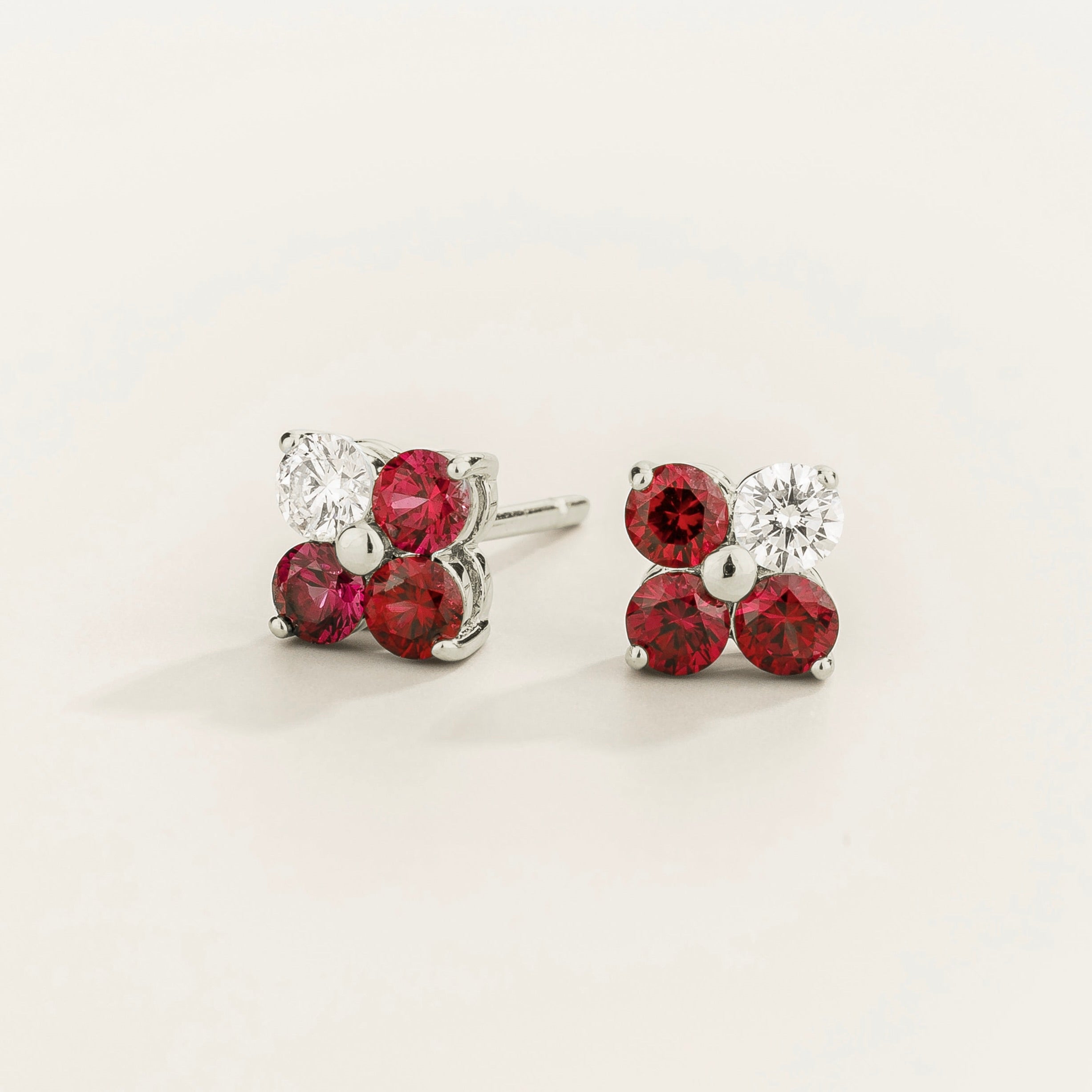 Petale 4-gemstones stud earrings in white gold set with ~0.7 carats of ruby and ~0.2 Diamonds