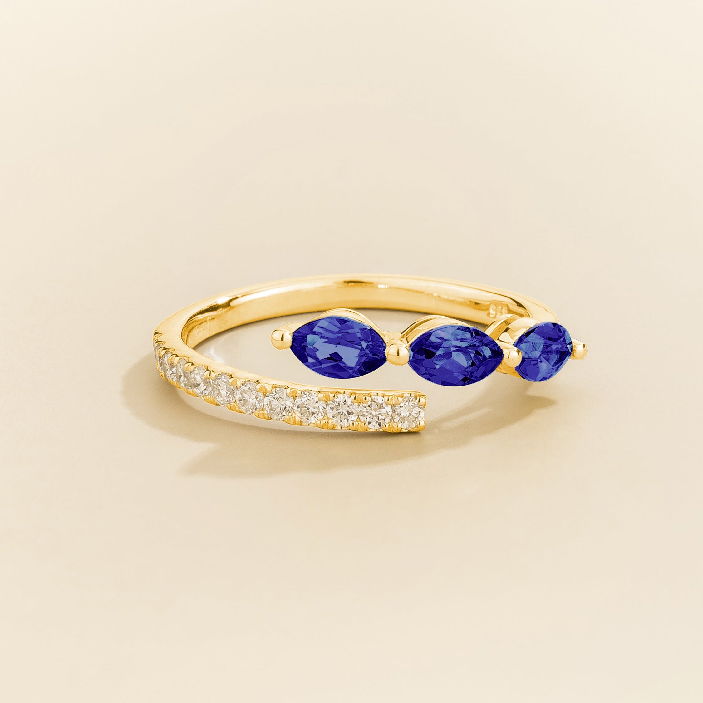 Sava ring in gold set with dark blue Sapphire and Diamonds.