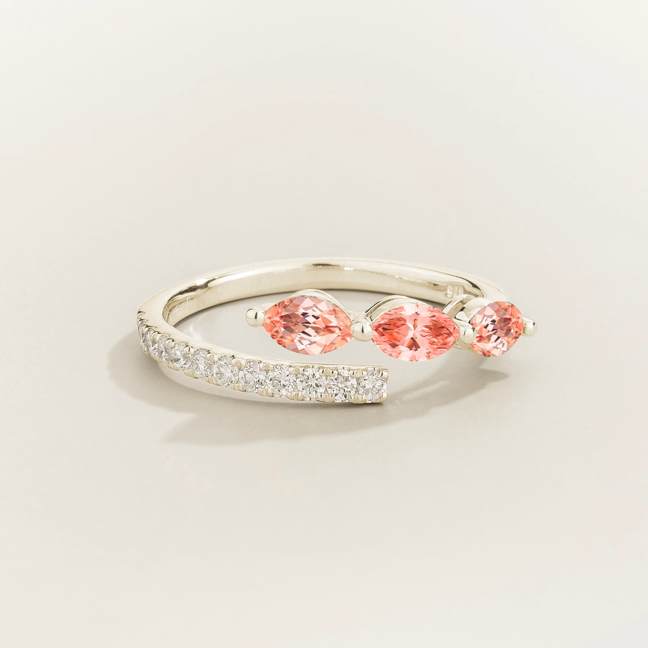 Sava ring in white gold set with Padparadscha Sapphire and Diamonds.