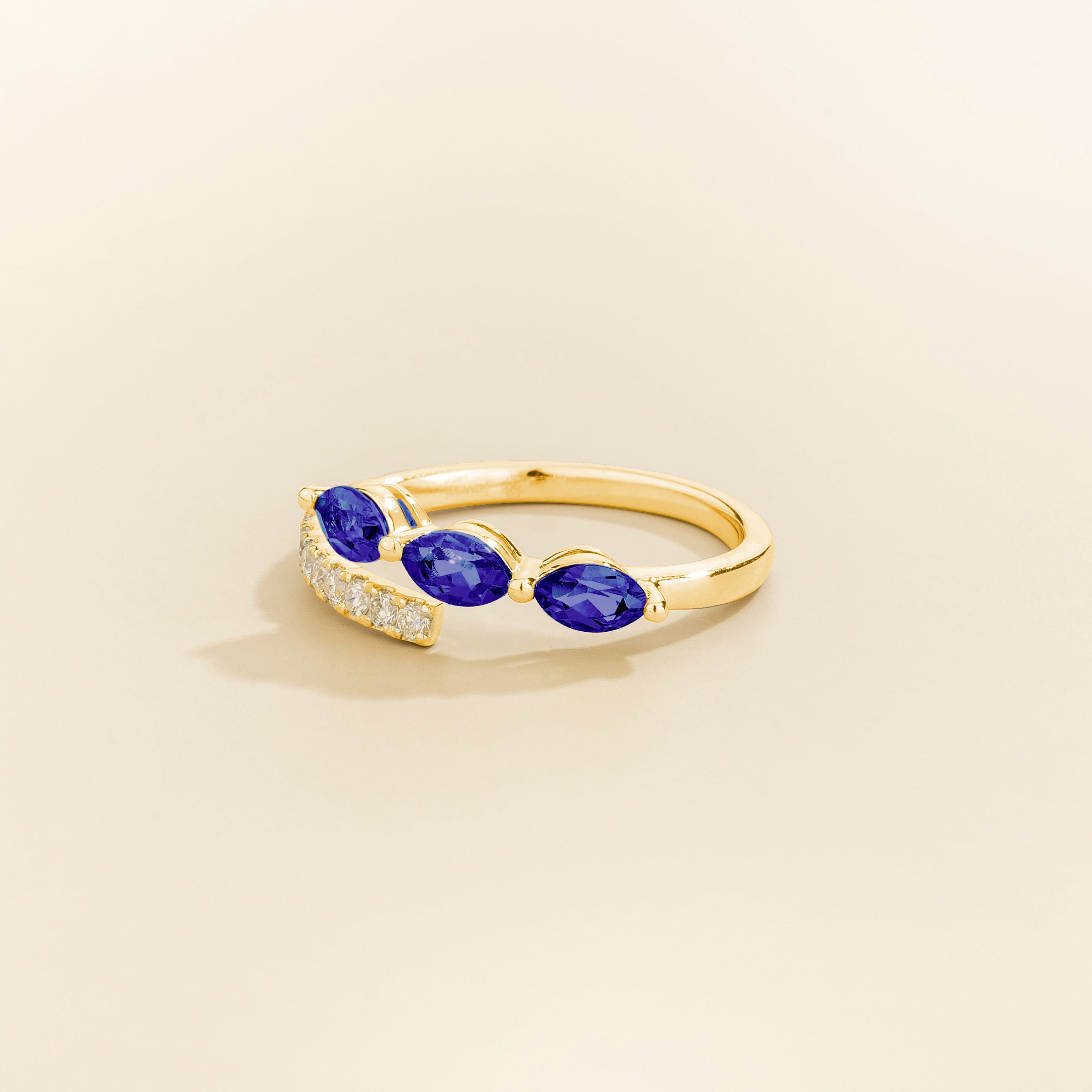 Sava ring in gold set with dark blue Sapphire and Diamonds.