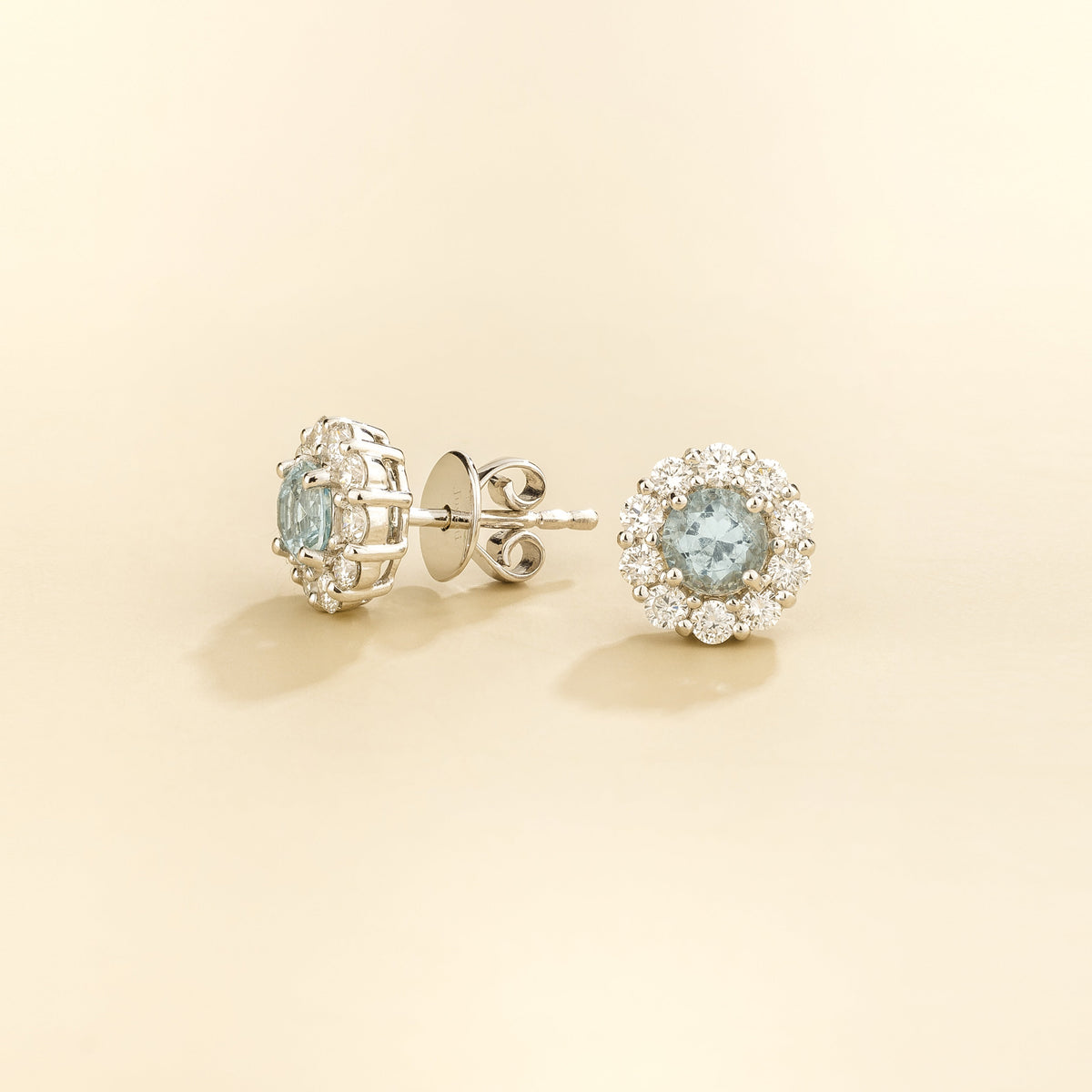 Talia Round Aquamarine & Diamond Halo Stud Earrings angled view
