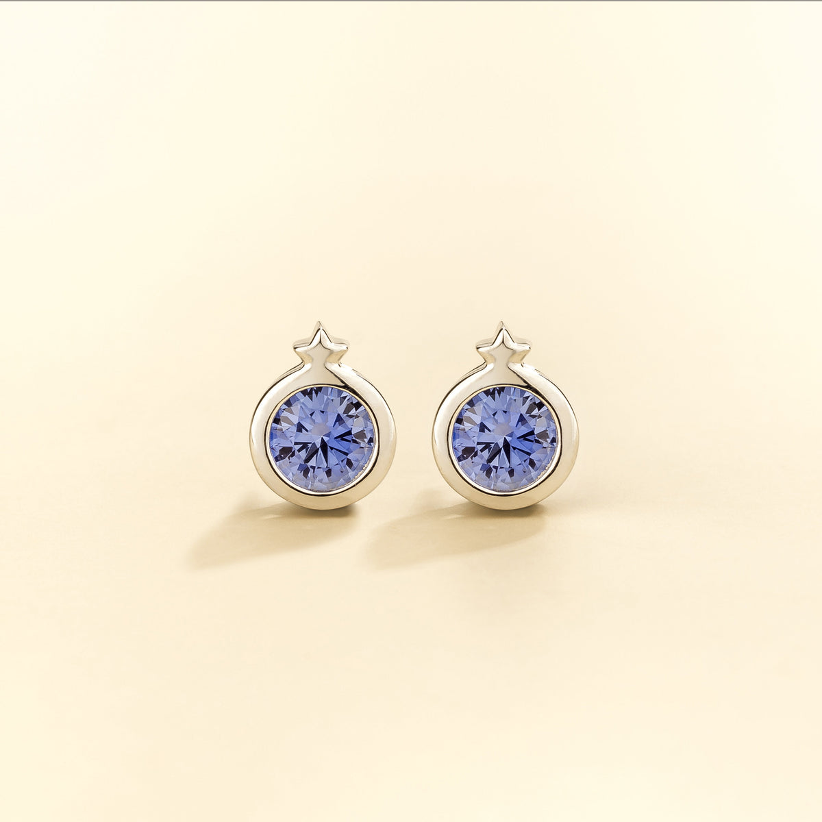 Kiki Blue Sapphire Round Bezel Set Solitaire Earrings in White Gold front