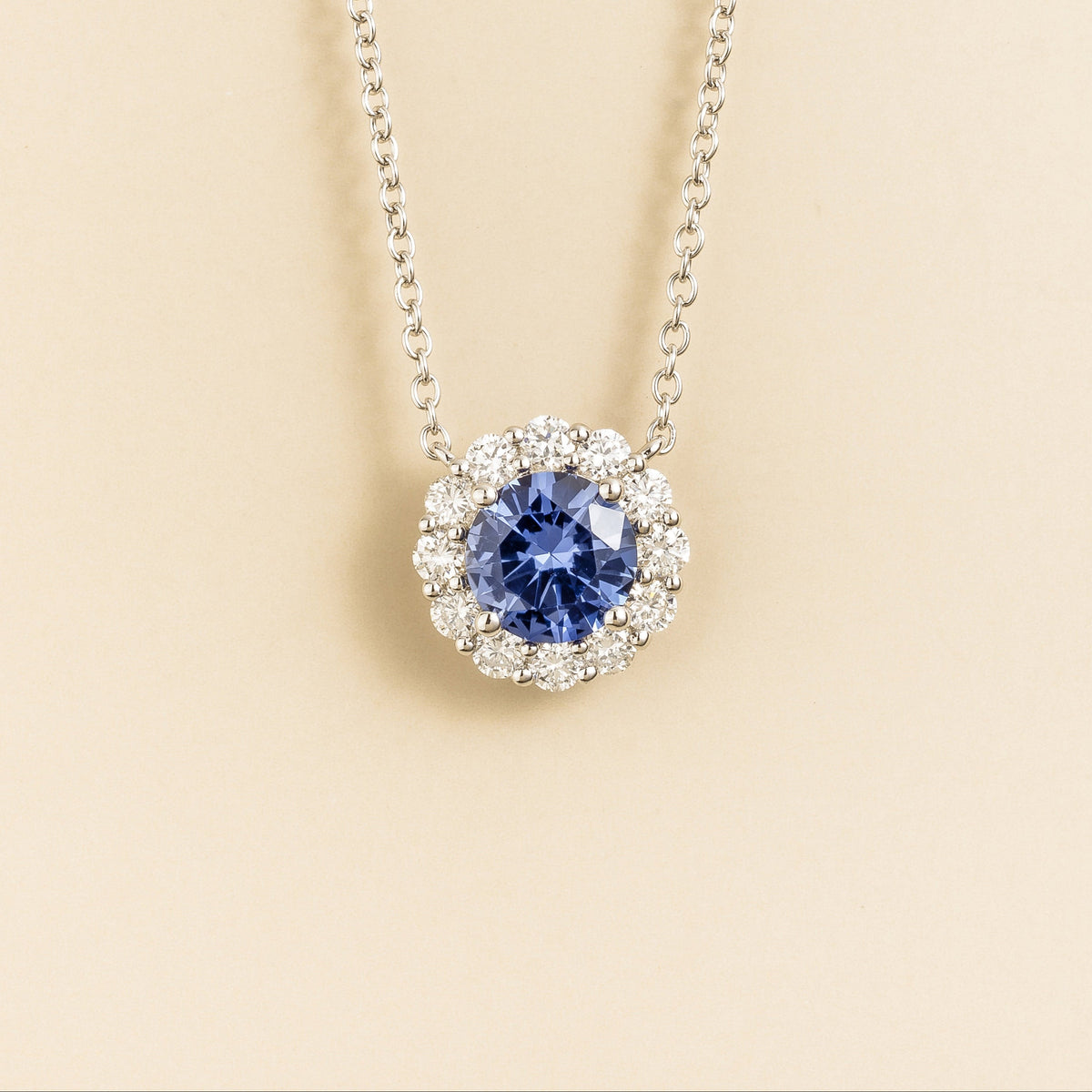 Zoe Blue Sapphire Round & Diamond Halo Necklace In White Gold front