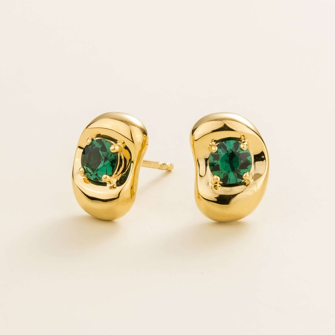 Fava gold earrings set with Emerald