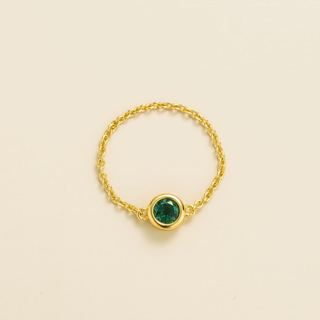 Unir gold ring set with Emerald