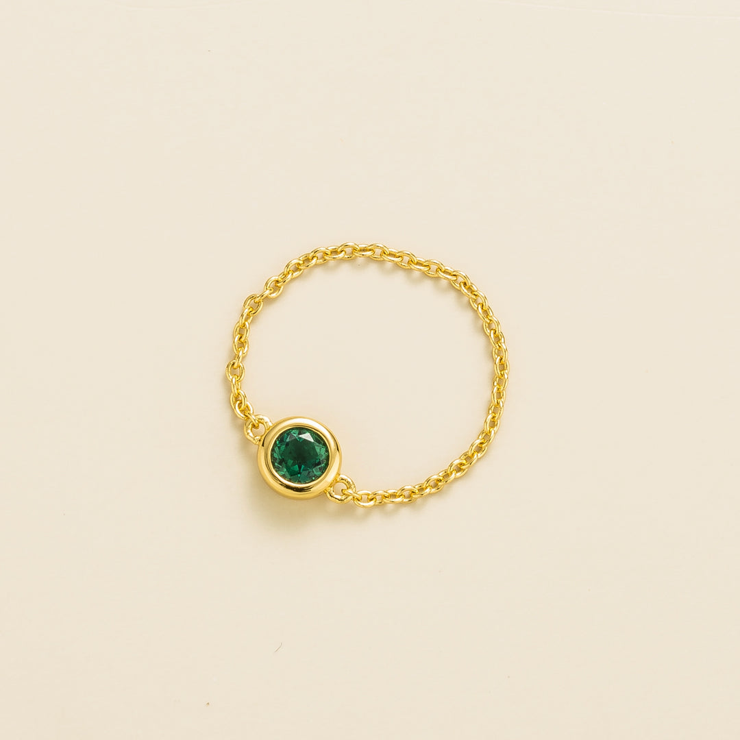 Unir gold ring set with Emerald