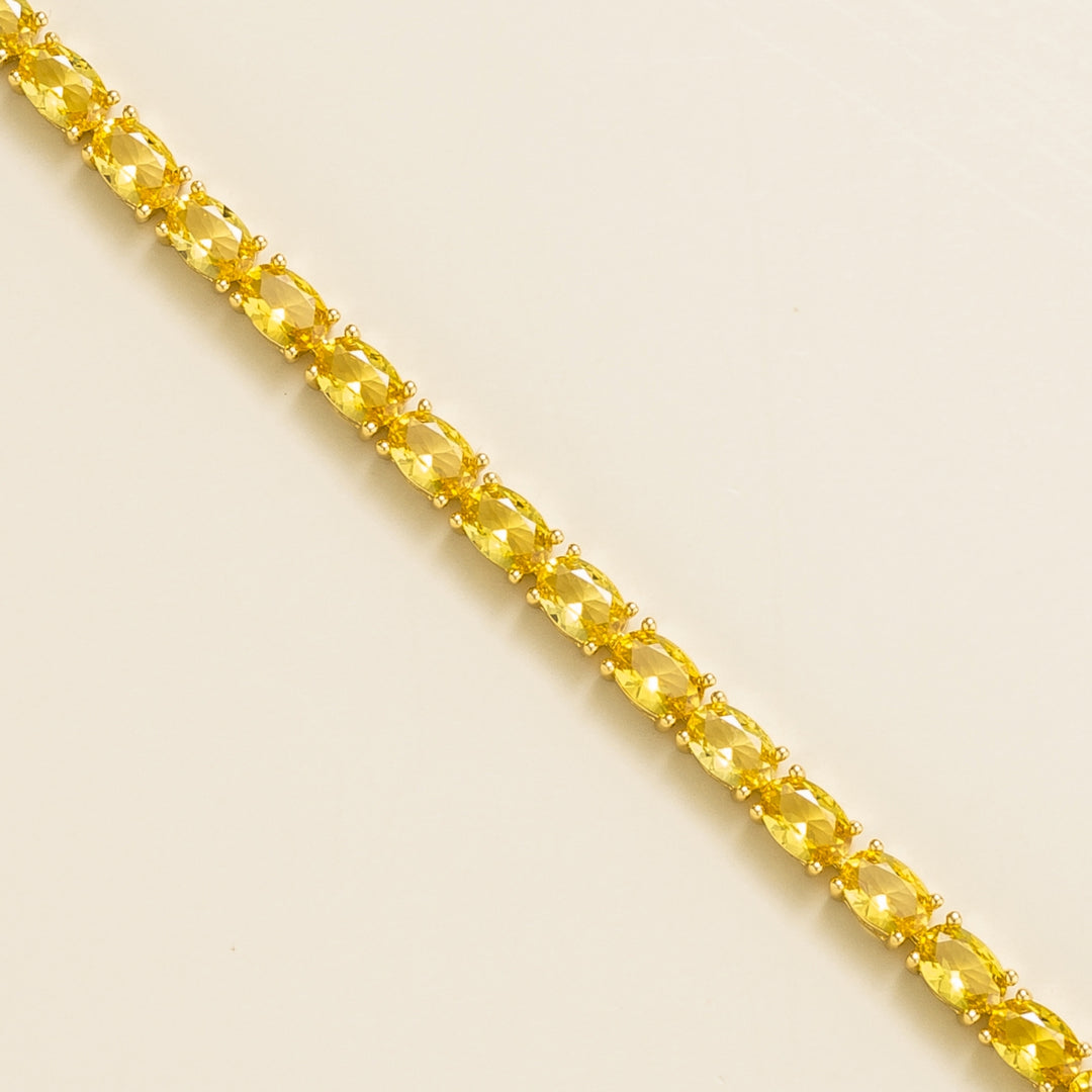Salto gold tennis bracelet set with Yellow sapphire