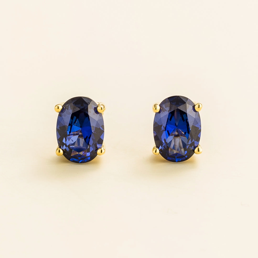Ova gold earrings set with Blue sapphire