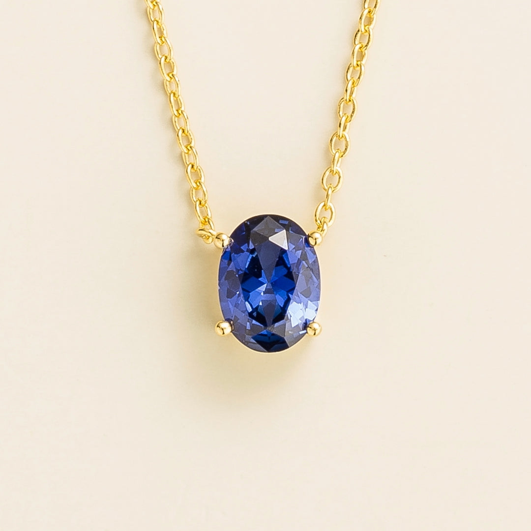 Ova gold necklace set with Blue sapphire