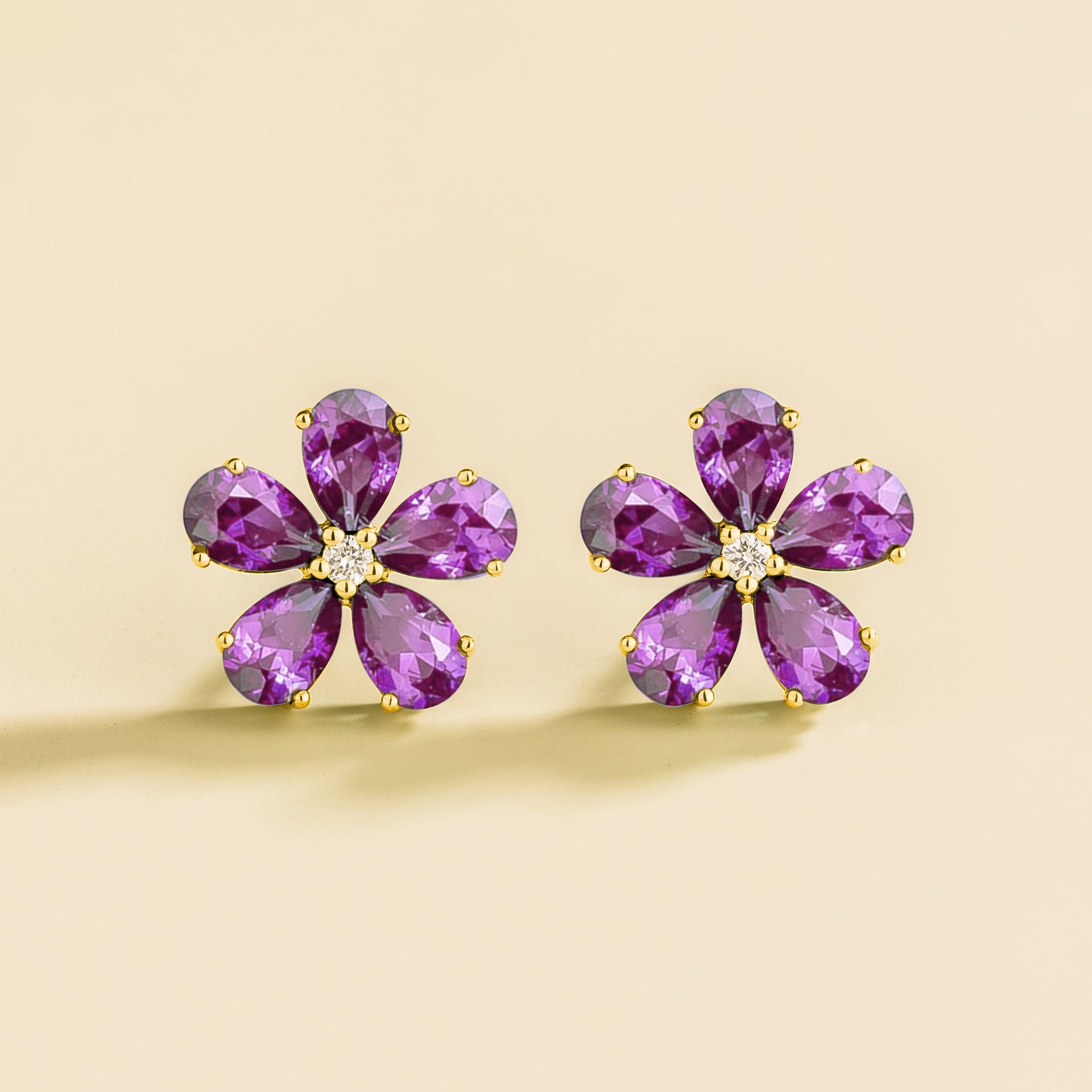 Florea 5 petals flower earrings in gold set with Purple Sapphires and Diamonds.