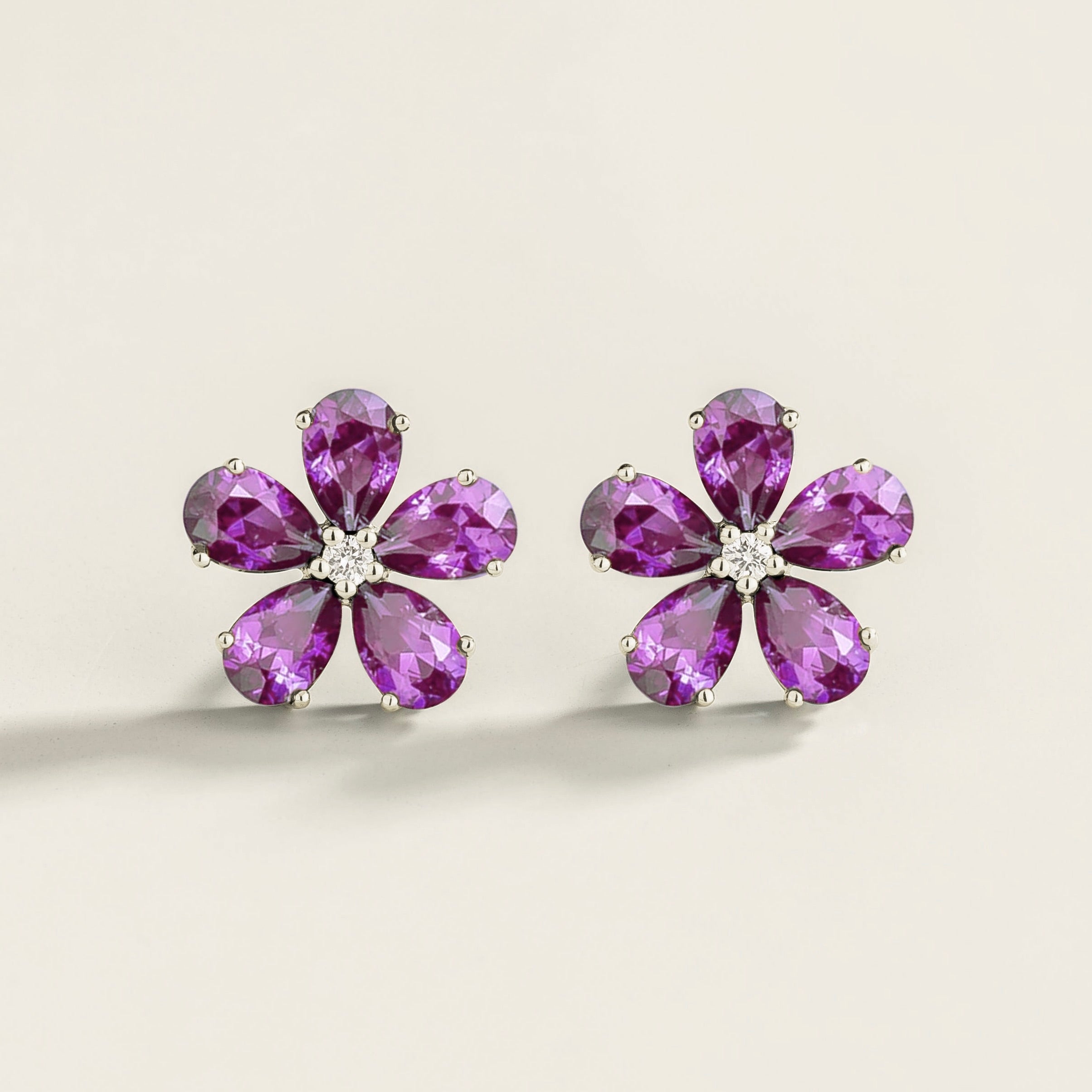 Florea 5 petals flower earrings in white gold set with Purple Sapphires and Diamonds.