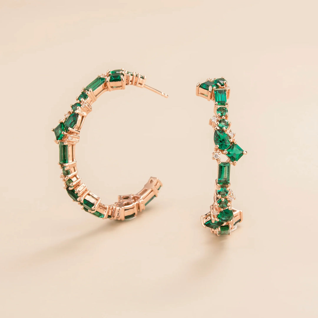 Lanna large hoop earrings in 18 kt pink gold vermeil set with lab grown Emerald and Diamond gem stones.