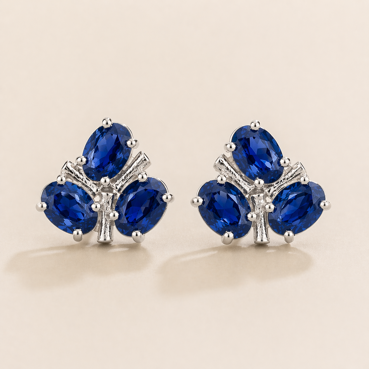 Ligna Oval Blue Sapphire Cluster Stud Earrings in White Gold