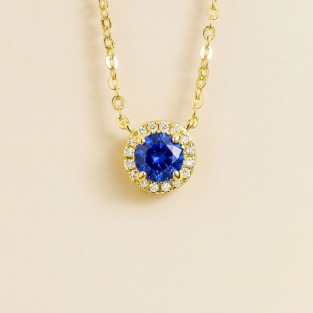 Round lab-grown blue sapphire and diamond halo Mars necklace in gold | Juvetti London