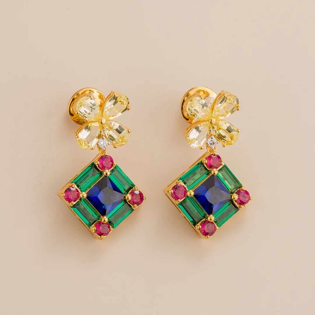 Medina earrings in 18K gold vermeil set with lab grown Yellow sapphire, Royal blue sapphire, Emerald and Diamond gem stones. Yellow sapphire flowers are attached to the princess drops set with ruby, blue sapphire and emerald.