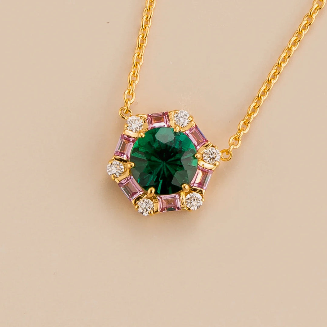 Melba hexagon necklace in 18K gold vermeil set with lab grown emerald, pink sapphire and diamond gem stones.