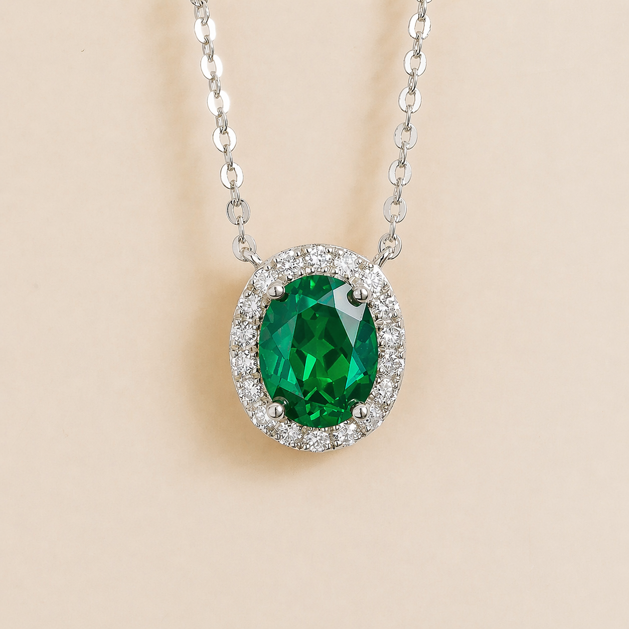 Mina Oval Emerald & Diamond Halo Necklace In White Gold