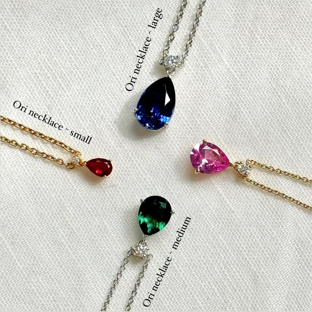 Ori Medium Pendant Necklace In Purple Sapphire and Diamond Set In Gold By Bespoke Jewellery London UK