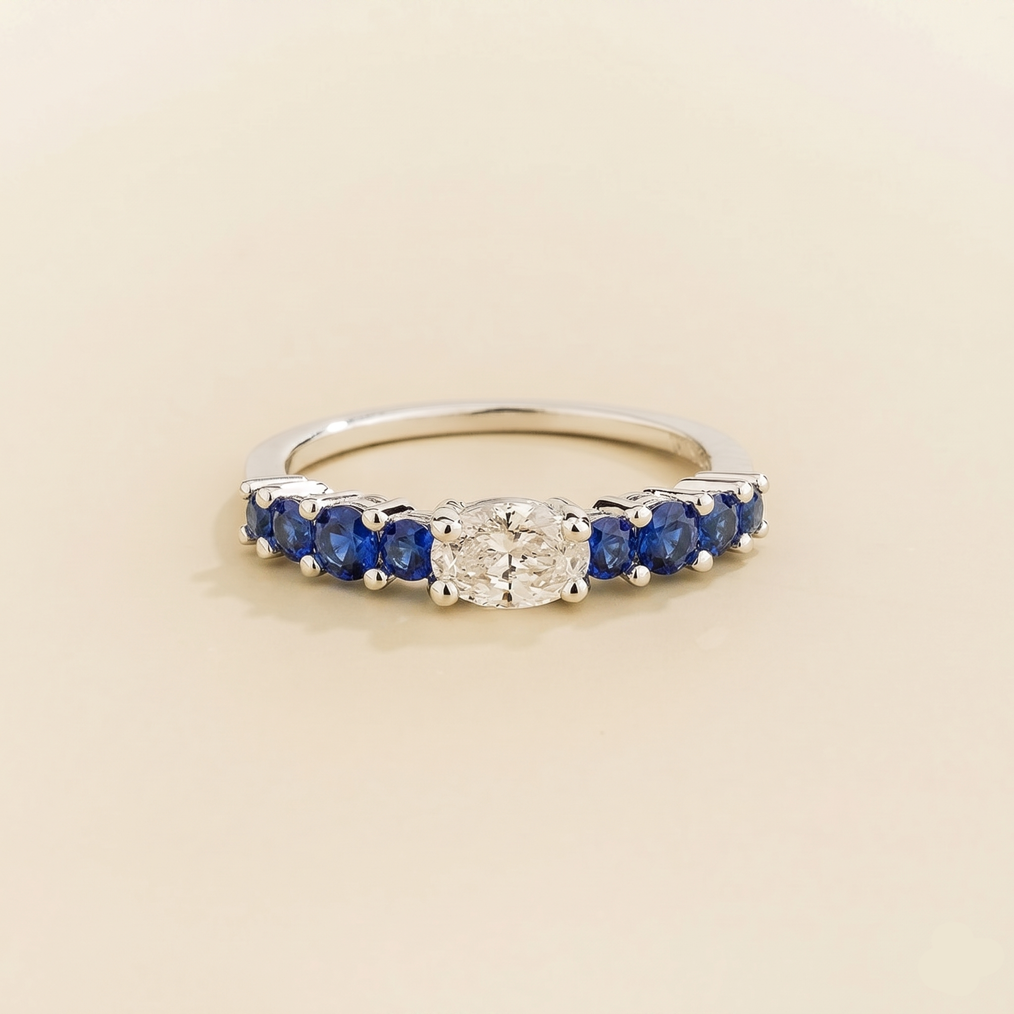 Petra Oval Diamond and Blue Sapphire Half Eternity Ring in White Gold