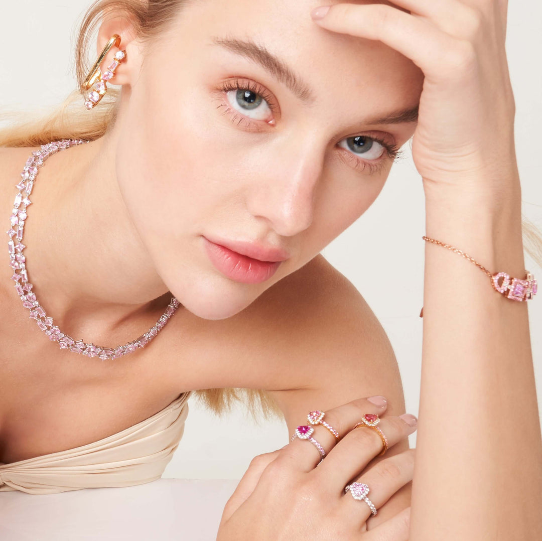 A beautiful model wearing Diana rings, Lago rosa necklace and Ciceris bracelet set with lab grown diamond and pink sapphire.