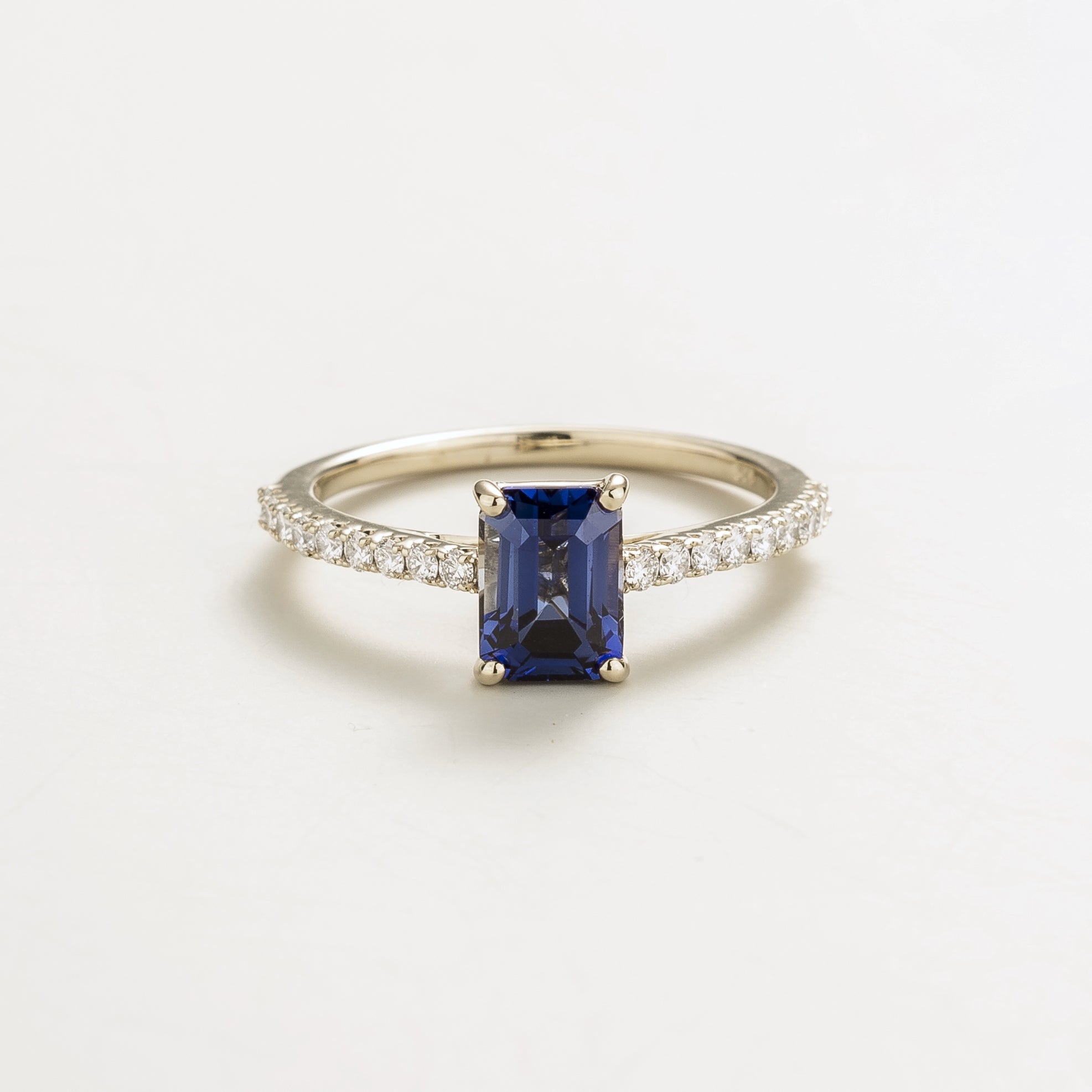 Juvetti white gold fine jewellery ring with lab-grown royal blue sapphire emerald cut and round lab-grown diamond 