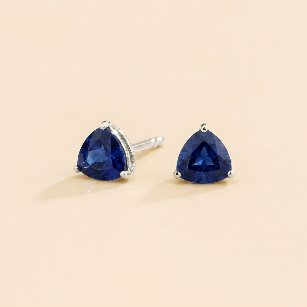 Trillion Blue Sapphire Solitaire Stud Earrings in White Gold