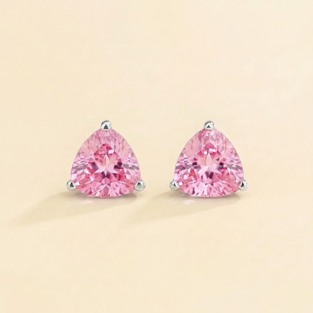 Trillion-cut lab-grown pink sapphire solitaire stud earrings in white gold | Juvetti London