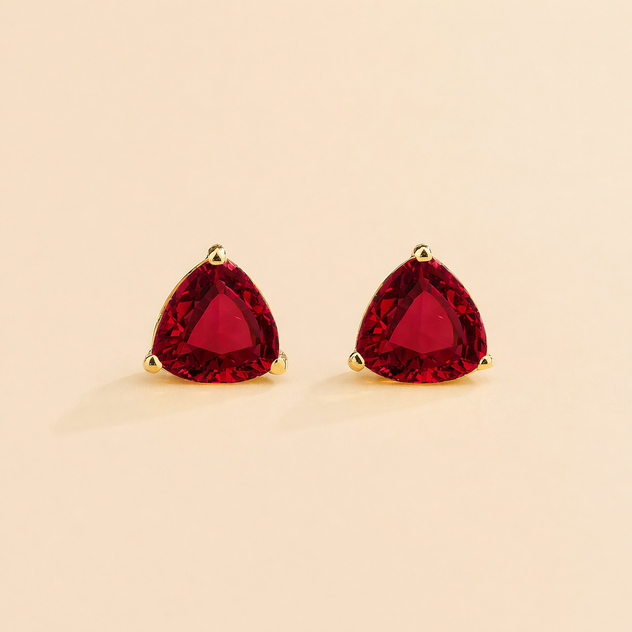 Trillion Ruby Solitaire Stud Earrings in Gold