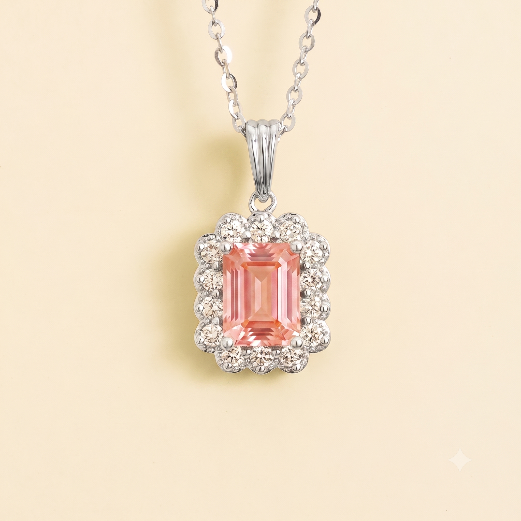 Emerald-cut lab-grown padparadscha sapphire and diamond halo pendant necklace in white gold | Juvetti London