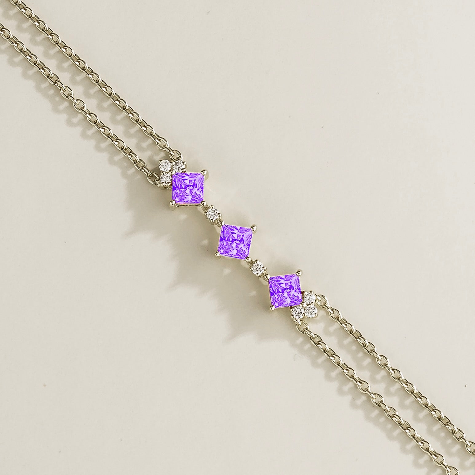 double chain white gold bracelet featuring purple sapphire gemstones and lab grown diamonds