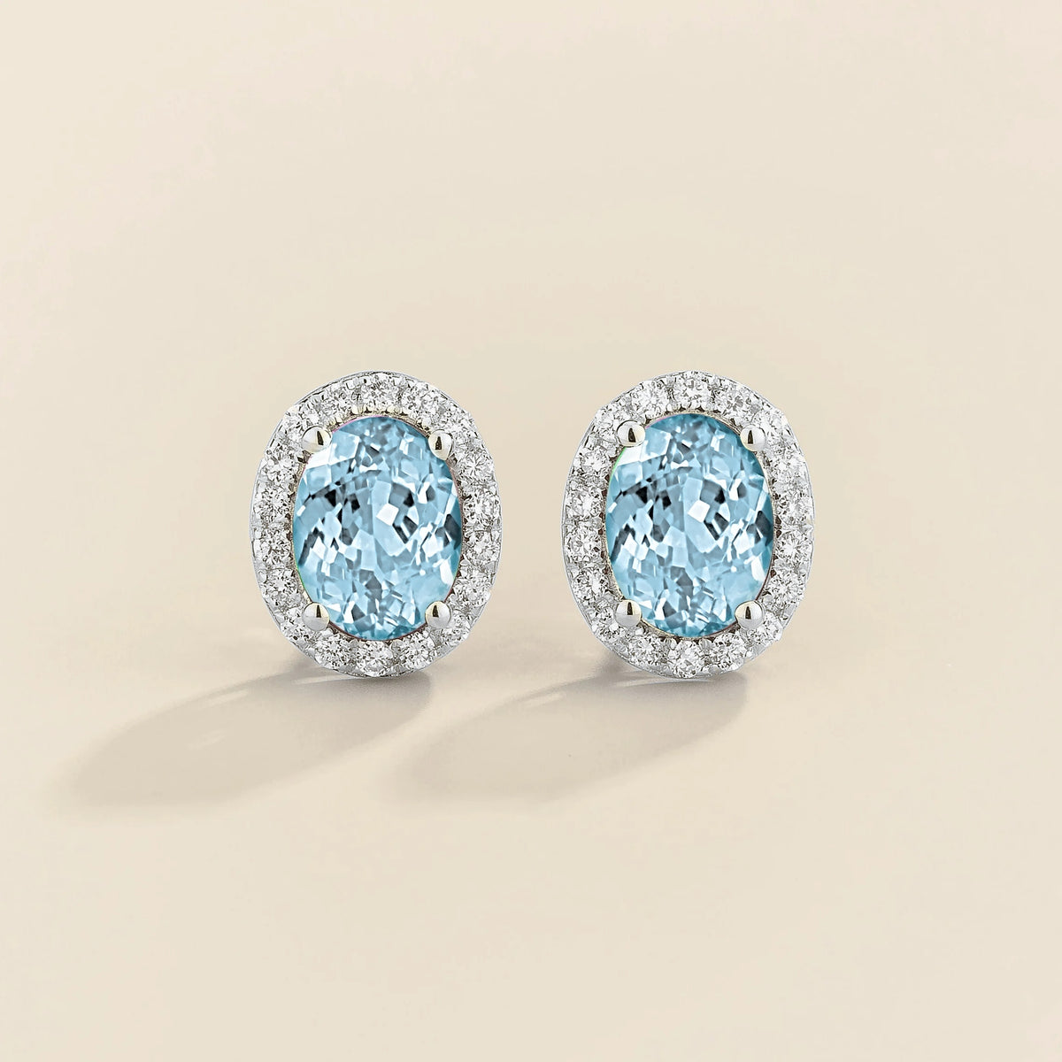 Lab-grown aquamarine and diamond oval halo stud earrings in white gold – front view | Mina by Juvetti