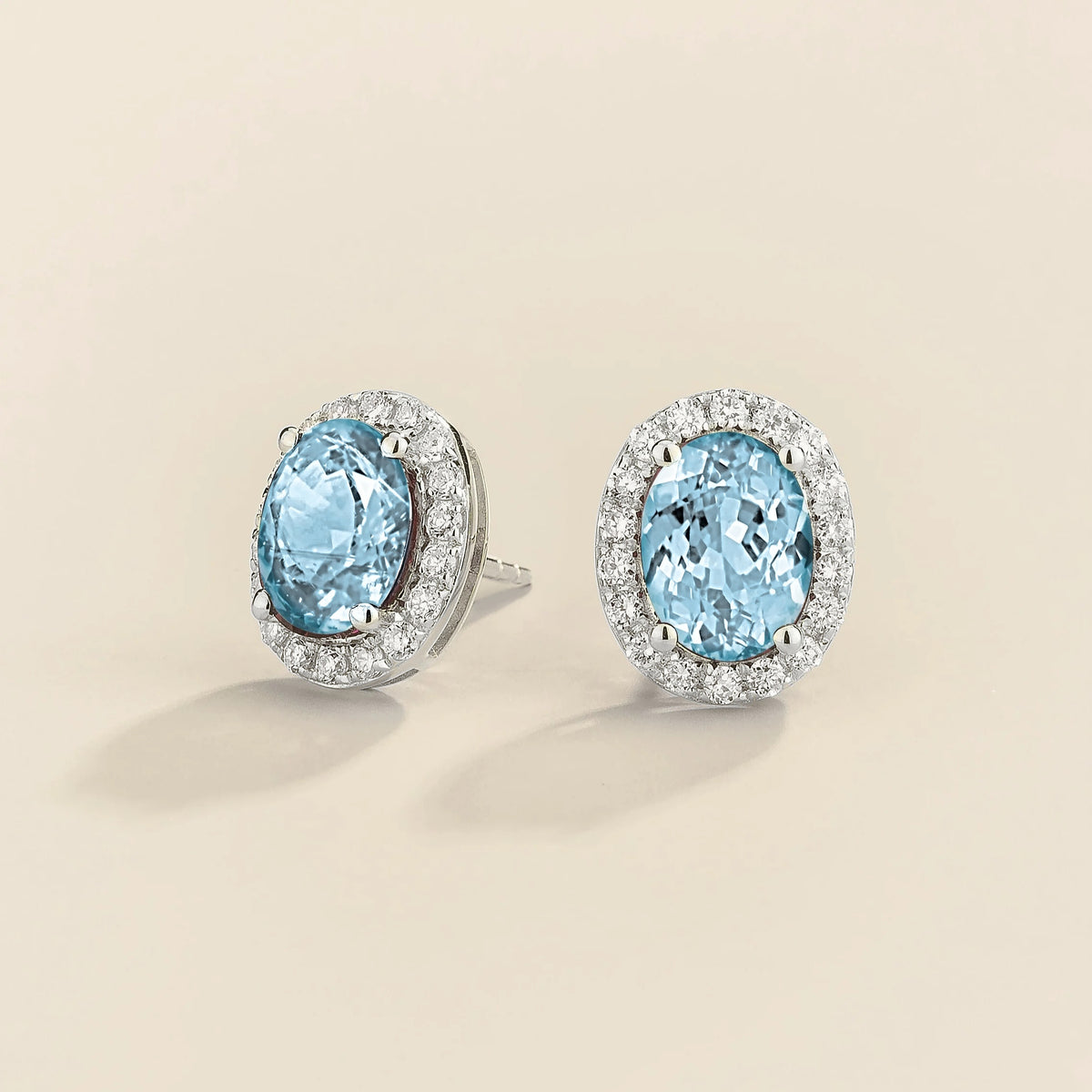 Lab-grown aquamarine and diamond oval halo stud earrings in white gold – side view | Mina by Juvetti