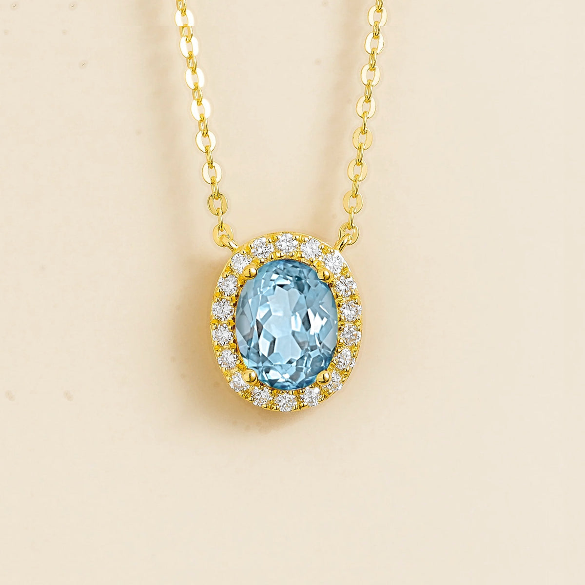 Lab-grown aquamarine and diamond oval halo necklace in gold – front view | Mina by Juvetti