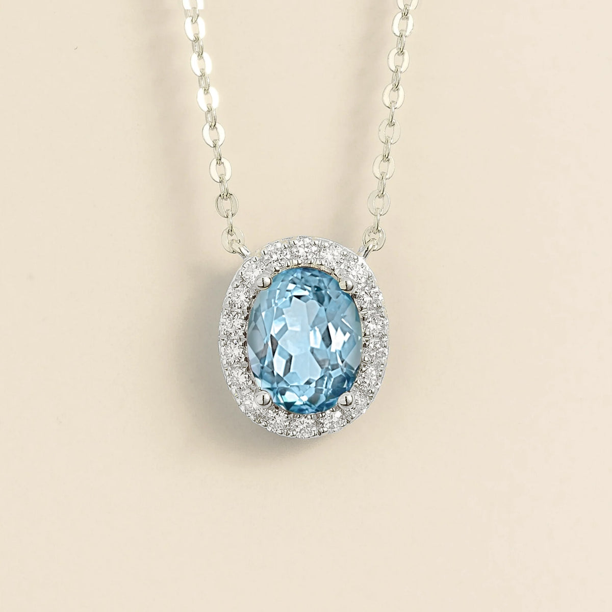Lab-grown aquamarine and diamond oval halo necklace in white gold – front view | Mina by Juvetti