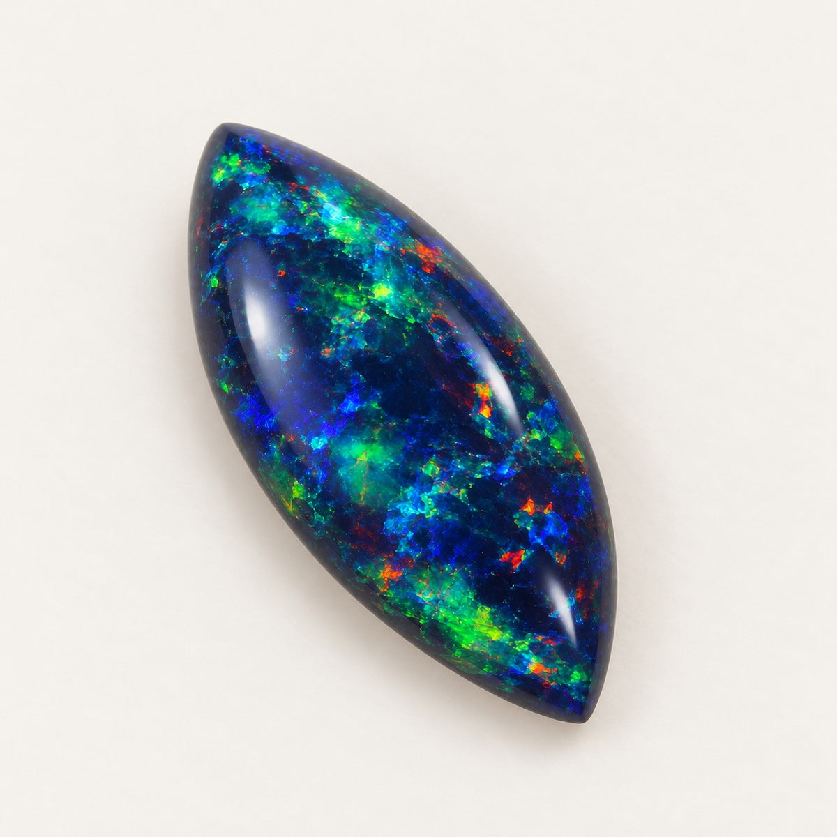 Black lab-grown opal, marquise cabochon, 45° view