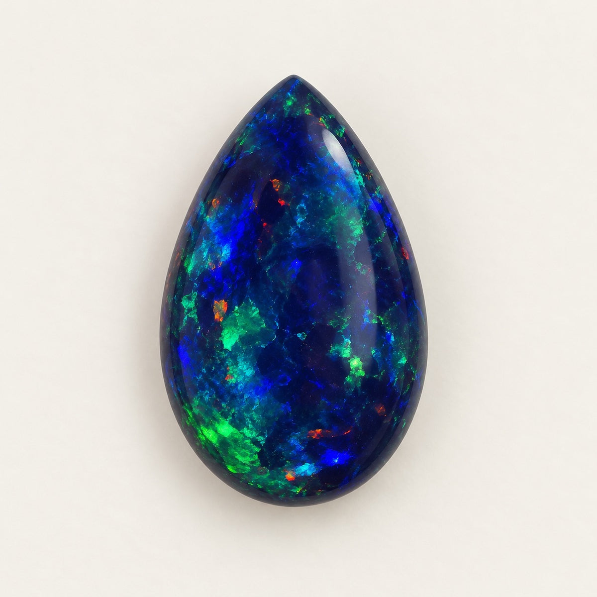 Black lab-grown opal, pear cabochon